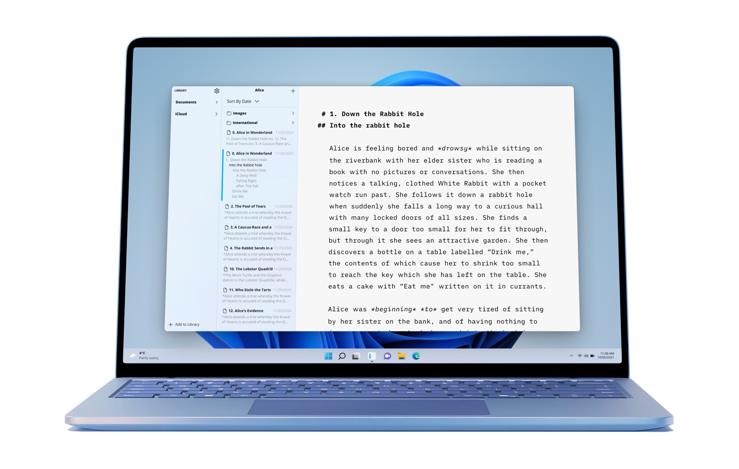 A laptop with Windows 11 wallpaper and iA Writer open on a page with a text from Alice in Wonderland.